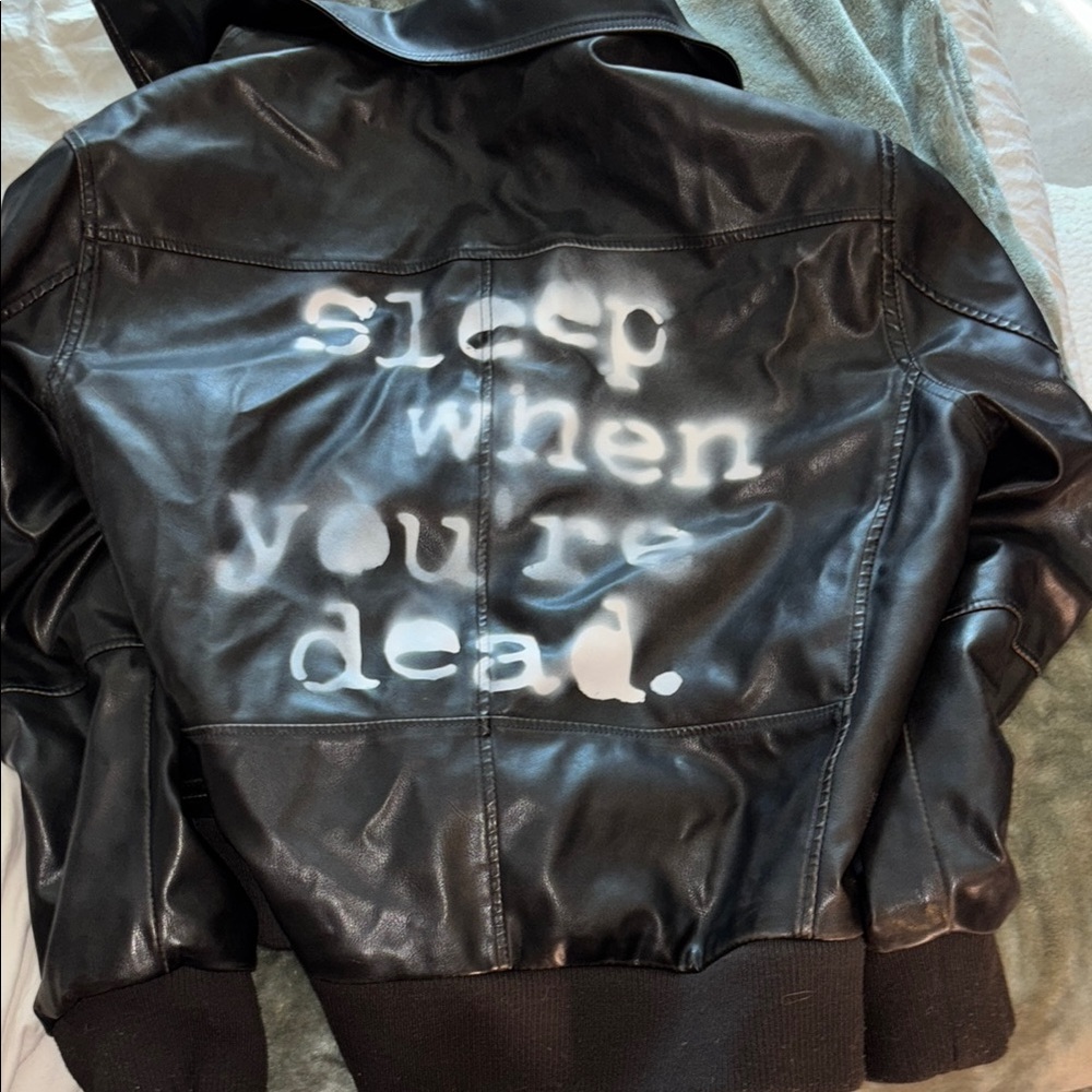Black Leather Jacket with White Text